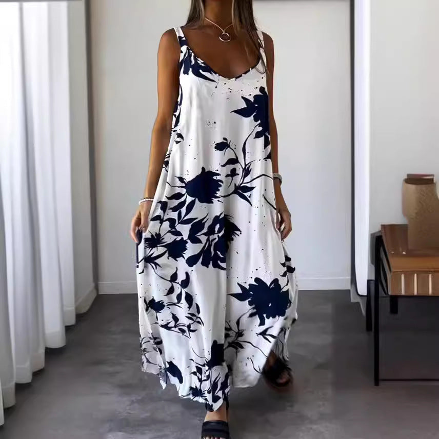 Damer flödande maxiklänning med elegant blommönster och djup V-ringning Mirla-Eva Jonsson