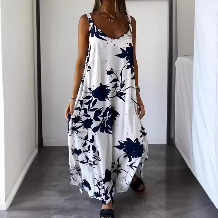Damer flödande maxiklänning med elegant blommönster och djup V-ringning Mirla-Eva Jonsson