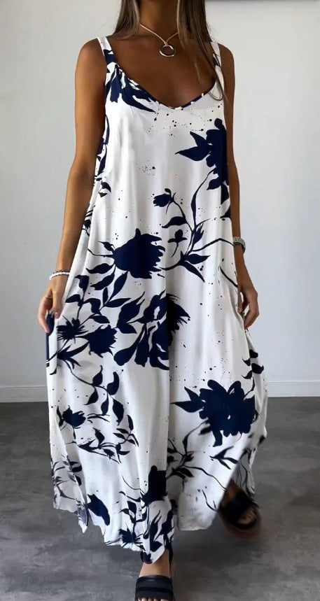 Damer flödande maxiklänning med elegant blommönster och djup V-ringning Mirla-Eva Jonsson