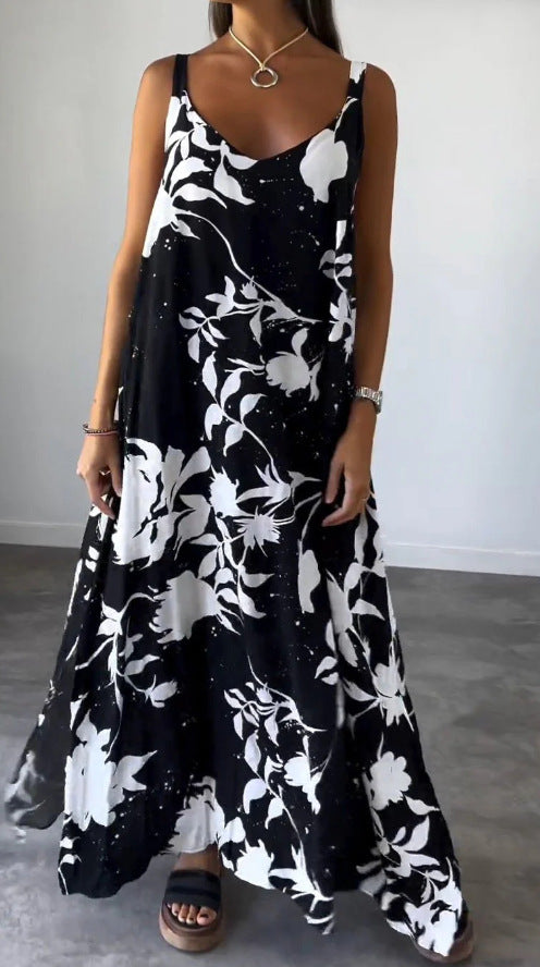 Damer flödande maxiklänning med elegant blommönster och djup V-ringning Mirla-Eva Jonsson