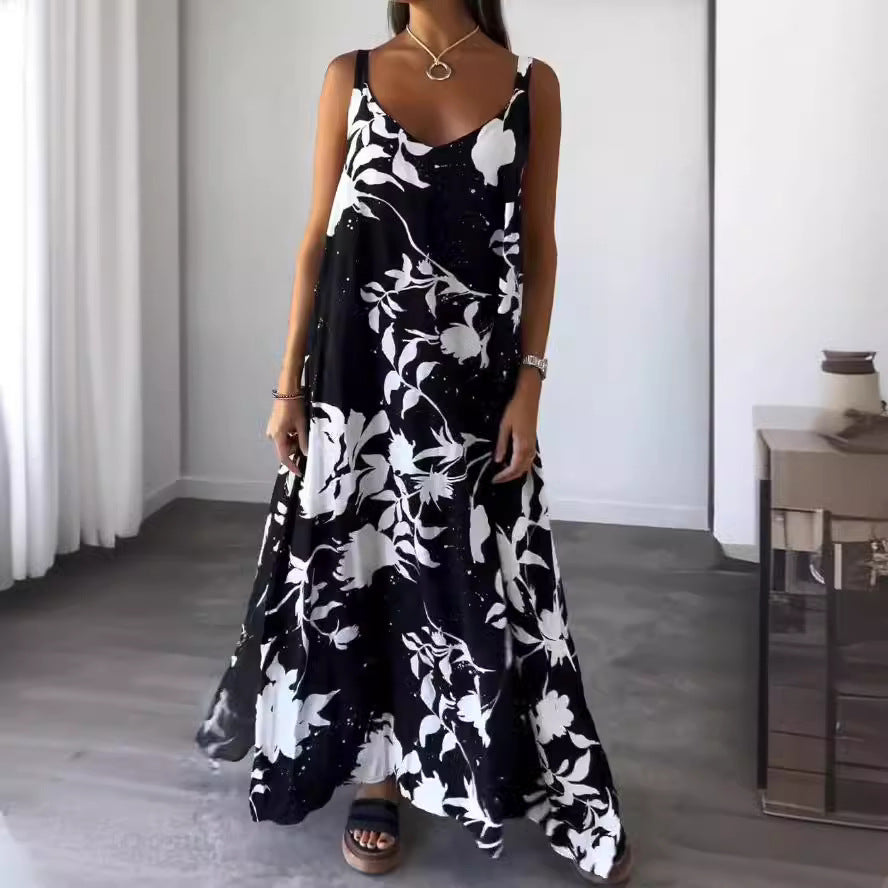 Damer flödande maxiklänning med elegant blommönster och djup V-ringning Mirla-Eva Jonsson