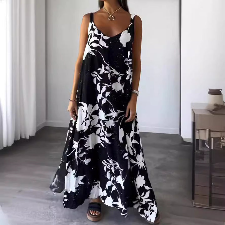 Damer flödande maxiklänning med elegant blommönster och djup V-ringning Mirla-Eva Jonsson