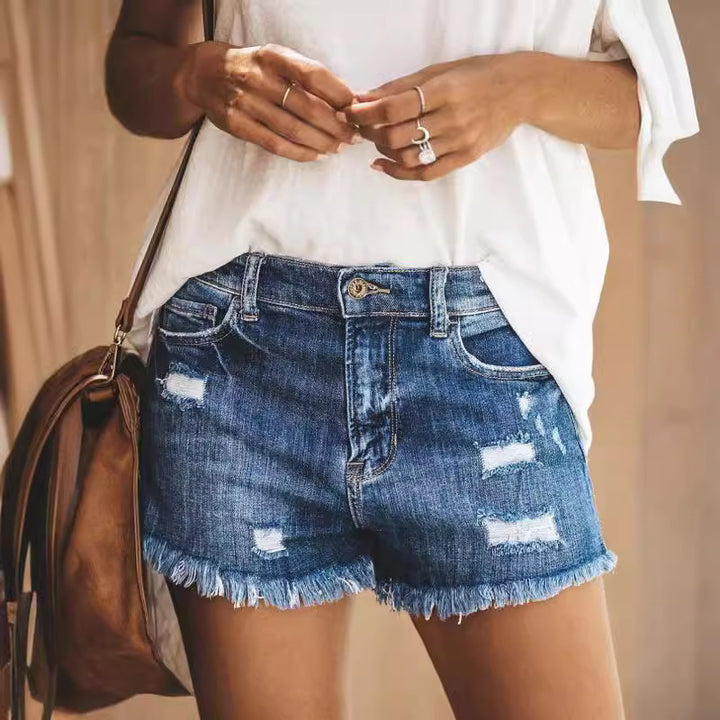 Damer förstörda denimshorts med fransig fåll och avslappnad passform Mirla-Eva Jonsson