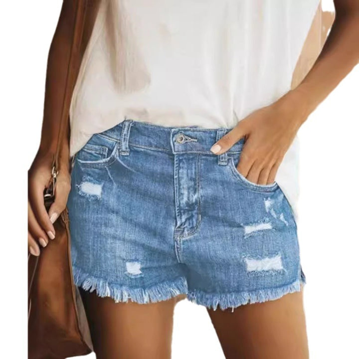 Damer förstörda denimshorts med fransig fåll och avslappnad passform Mirla-Eva Jonsson