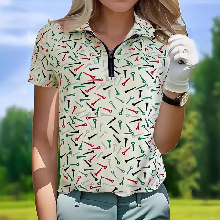 Damer golfpolo med modern dragkedja och livlig design Mirla-Eva Jonsson