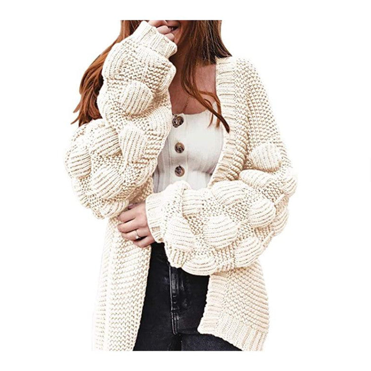 Damer grovstickad cardigan med voluminösa puffärmar och elegant V-hals Mirla-Eva Jonsson