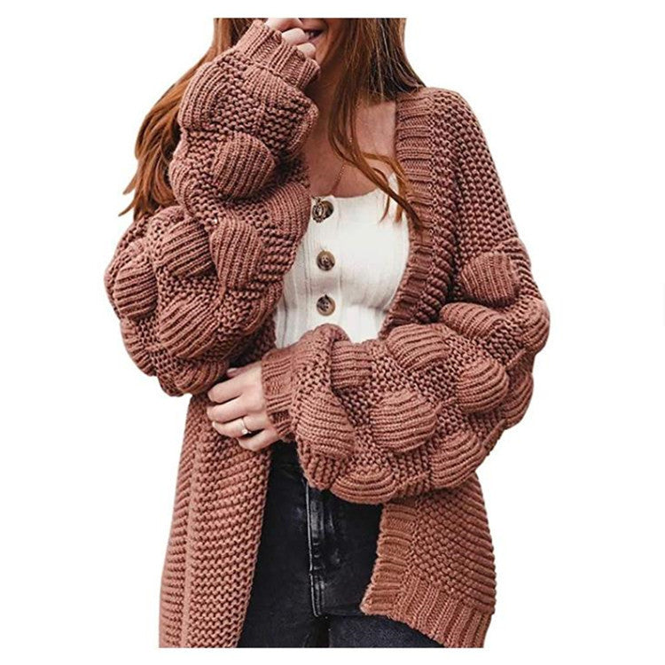 Damer grovstickad cardigan med voluminösa puffärmar och elegant V-hals Mirla-Eva Jonsson