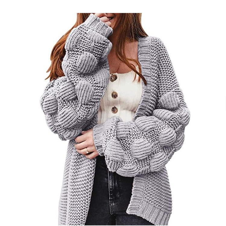 Damer grovstickad cardigan med voluminösa puffärmar och elegant V-hals Mirla-Eva Jonsson
