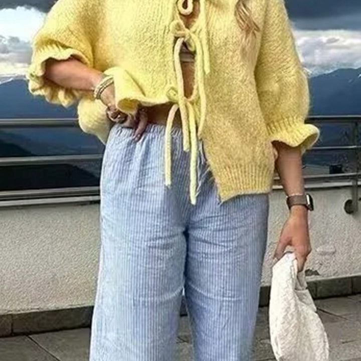 Damer grovstickad jacka med lekfullt knutna detaljer Eva Jonsson-Eva Jonsson