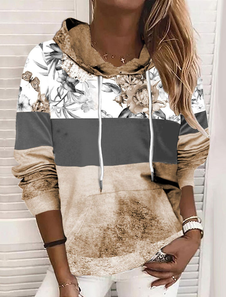 Damer hooded sweatshirt med blommig design och färgblock Mirla-Eva Jonsson