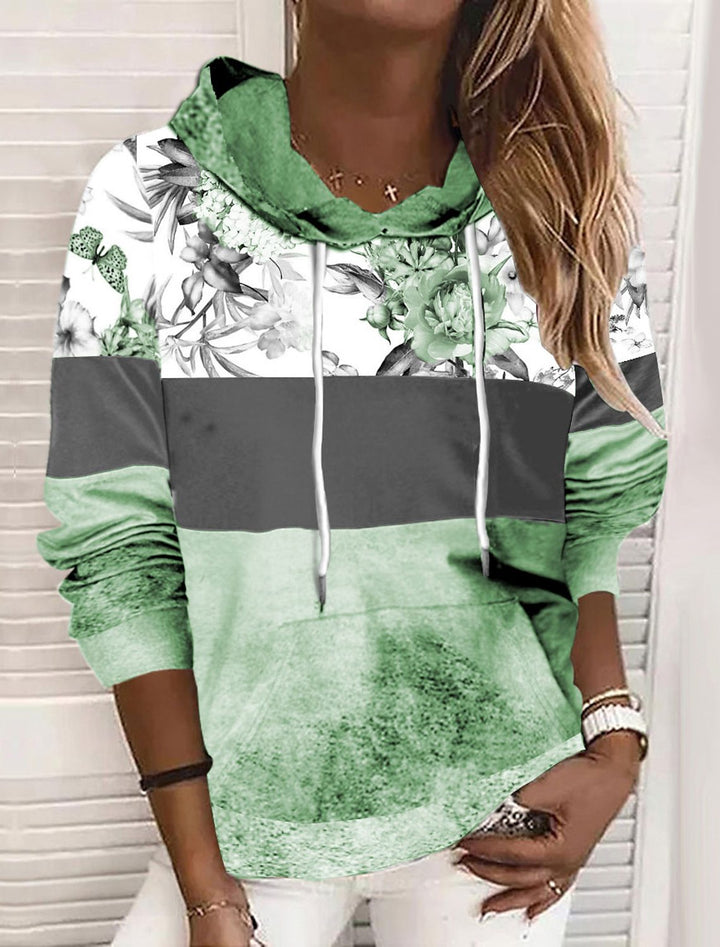 Damer hooded sweatshirt med blommig design och färgblock Mirla-Eva Jonsson