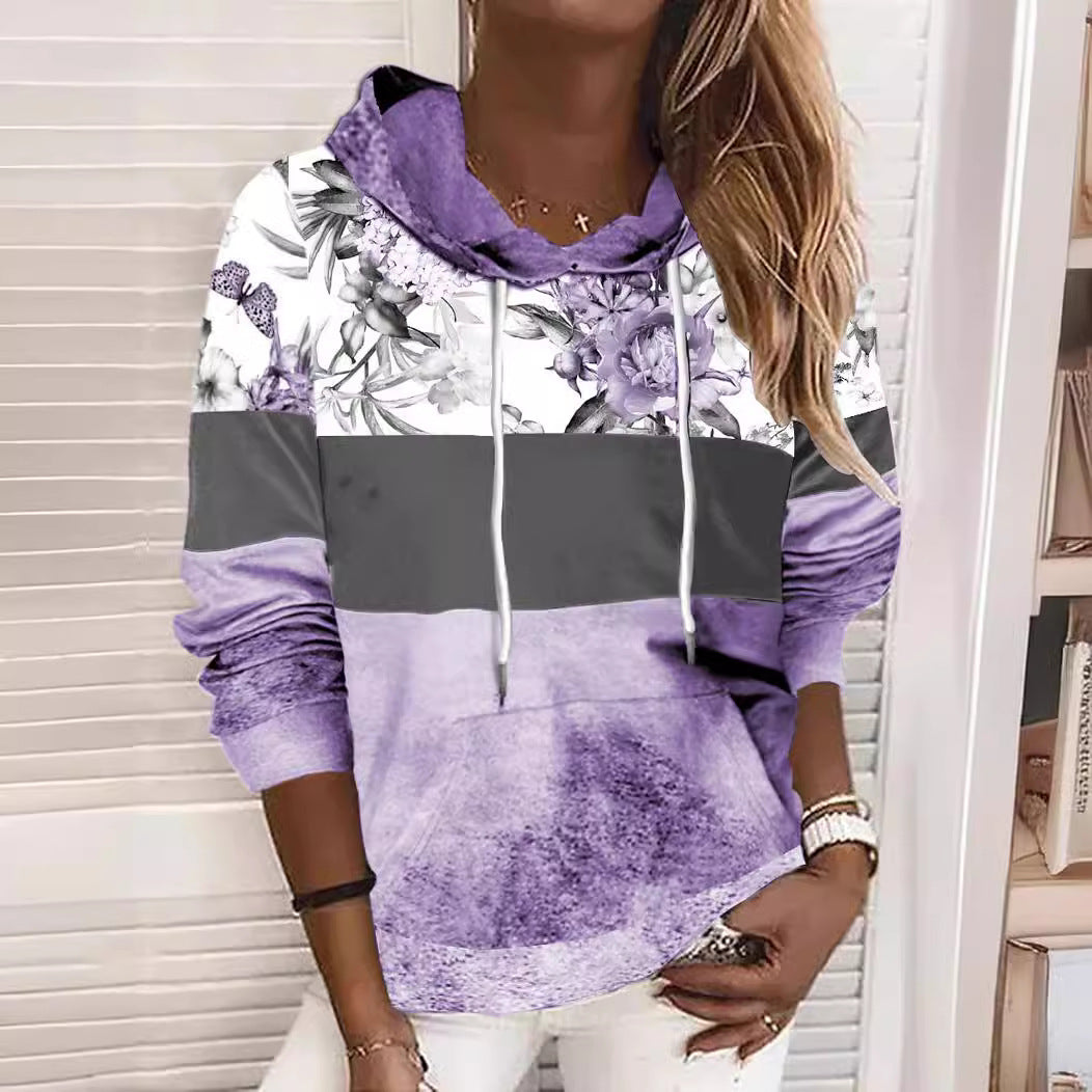 Damer hooded sweatshirt med blommig design och färgblock Mirla-Eva Jonsson