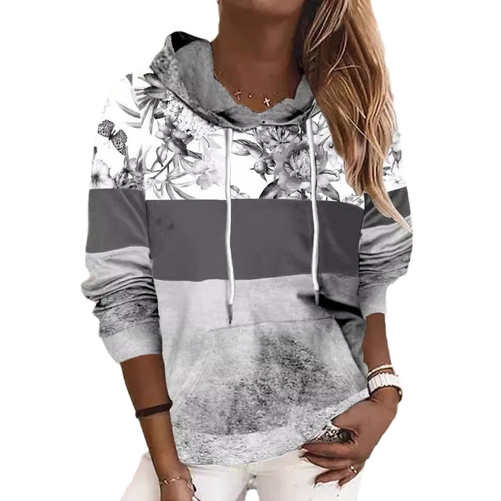 Damer hooded sweatshirt med blommig design och färgblock Mirla-Eva Jonsson