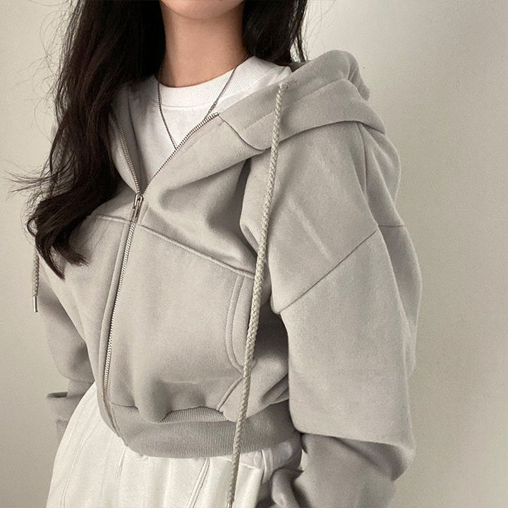 Damer hooded sweatshirt med oversized skärning och praktiska fickor Mirla-Eva Jonsson