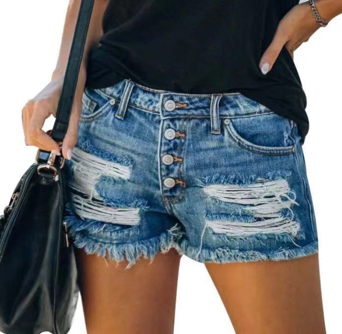 Damer jeansshorts i retrostil med unika patchdetaljer Mirla-Eva Jonsson