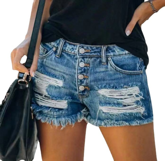 Damer jeansshorts i retrostil med unika patchdetaljer Mirla-Eva Jonsson