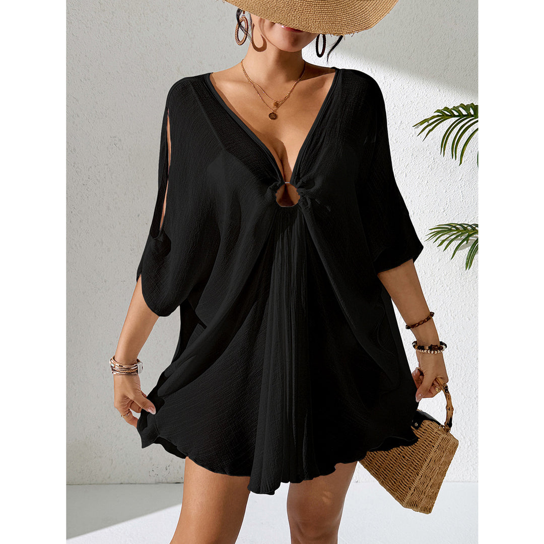 Damer kaftan med djup V-ringning och indraget design Mirla-Eva Jonsson