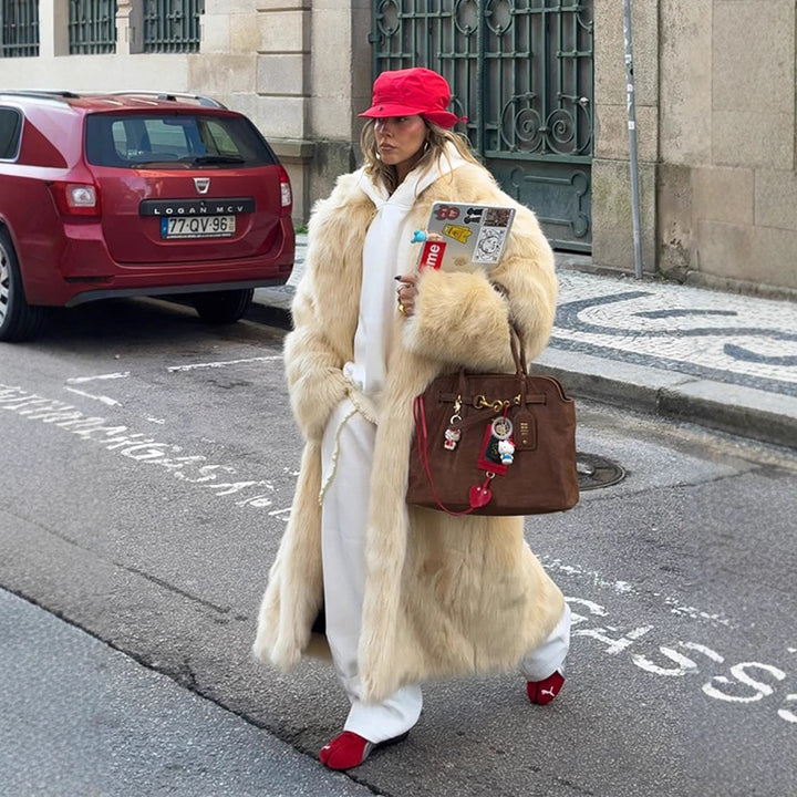 Damer konstpälsrock med voluminösa ärmar och elegant skärning Eva Jonsson-Eva Jonsson