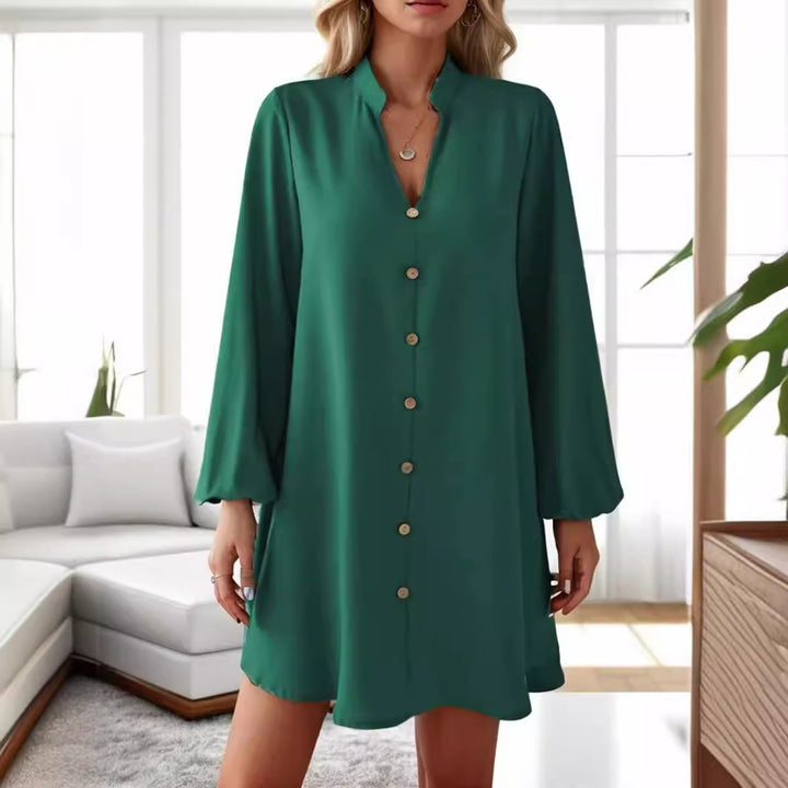Damer kort klänning med knapplist och eleganta puffärmar Mirla-Eva Jonsson