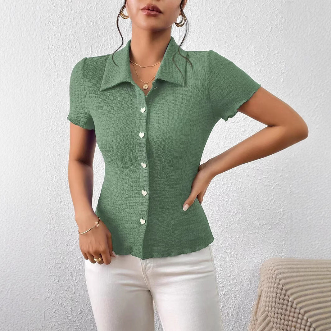 Damer kortärmad blus med strukturerad design och hjärtformade knappar Mirla-Eva Jonsson