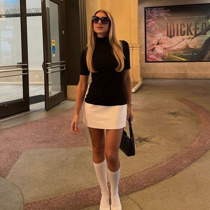 Damer kortärmad topp med stilfull polokrage och moderiktig snitt Mirla-Eva Jonsson