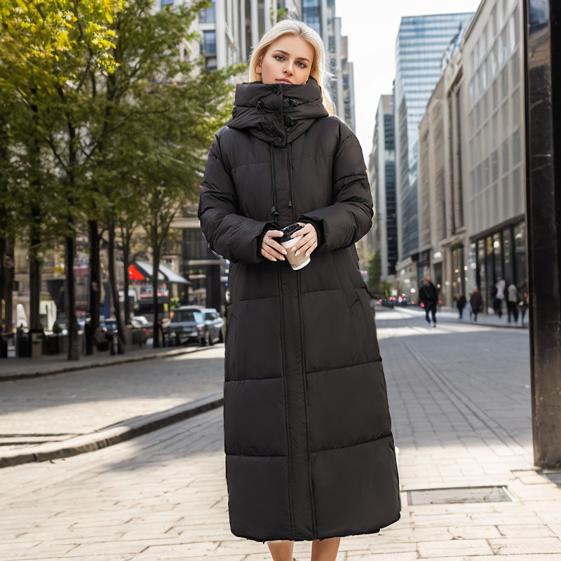 Damer lång puffer-kappa med lyxig konstpälskrage och praktiska fickor Mirla-Eva Jonsson