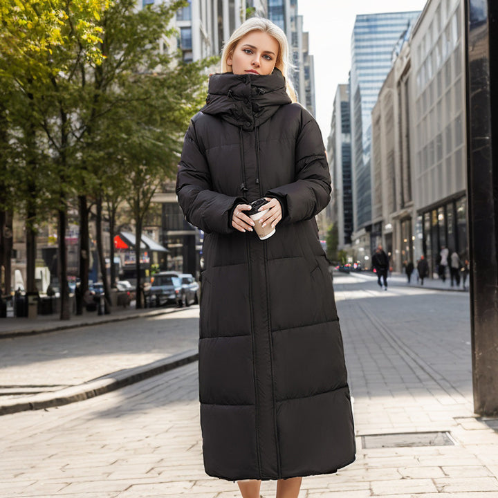 Damer lång puffer-kappa med lyxig konstpälskrage och praktiska fickor Mirla-Eva Jonsson