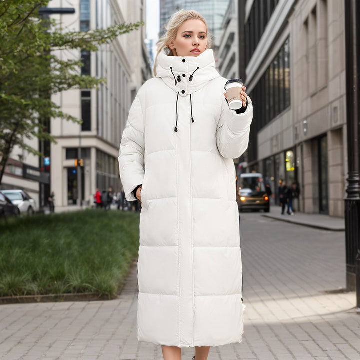 Damer lång puffer-kappa med lyxig konstpälskrage och praktiska fickor Mirla-Eva Jonsson