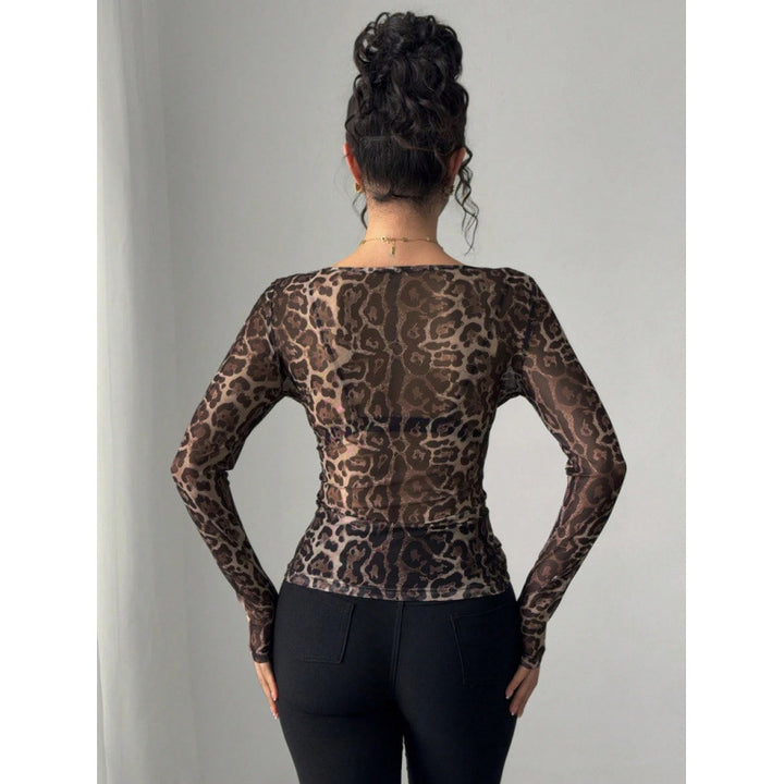 Damer långärmad body med transparent leopardmönster och figurnära passform Mirla-Eva Jonsson