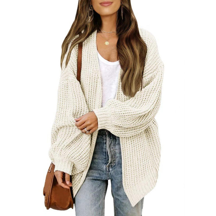 Damer lös stickad cardigan med voluminösa ärmar och strukturerad design Mirla-Eva Jonsson