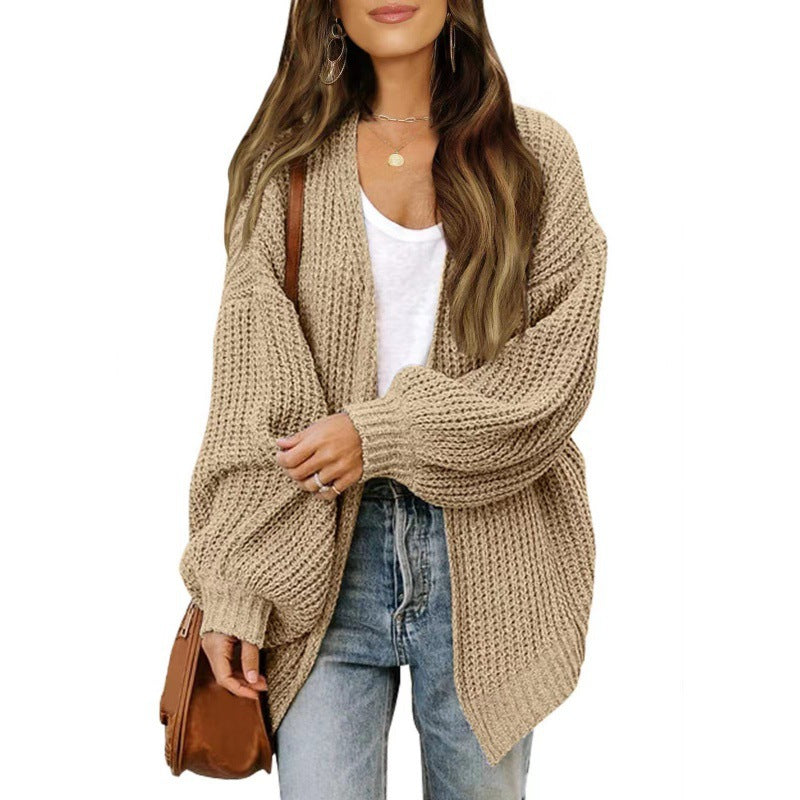 Damer lös stickad cardigan med voluminösa ärmar och strukturerad design Mirla-Eva Jonsson