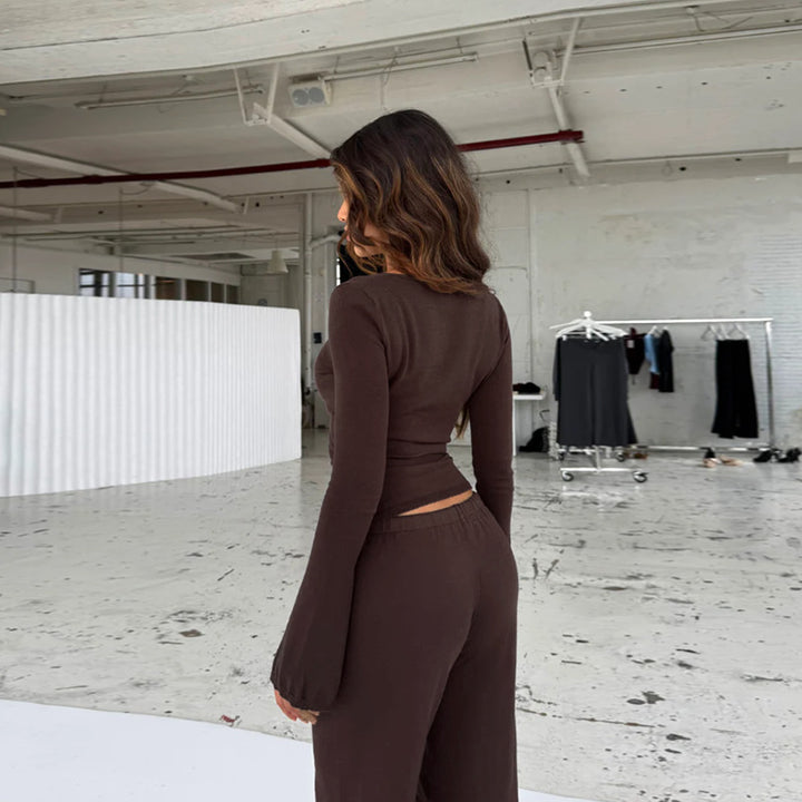 Damer löst jumpsuit med omslagdesign och långa ärmar Mirla-Eva Jonsson