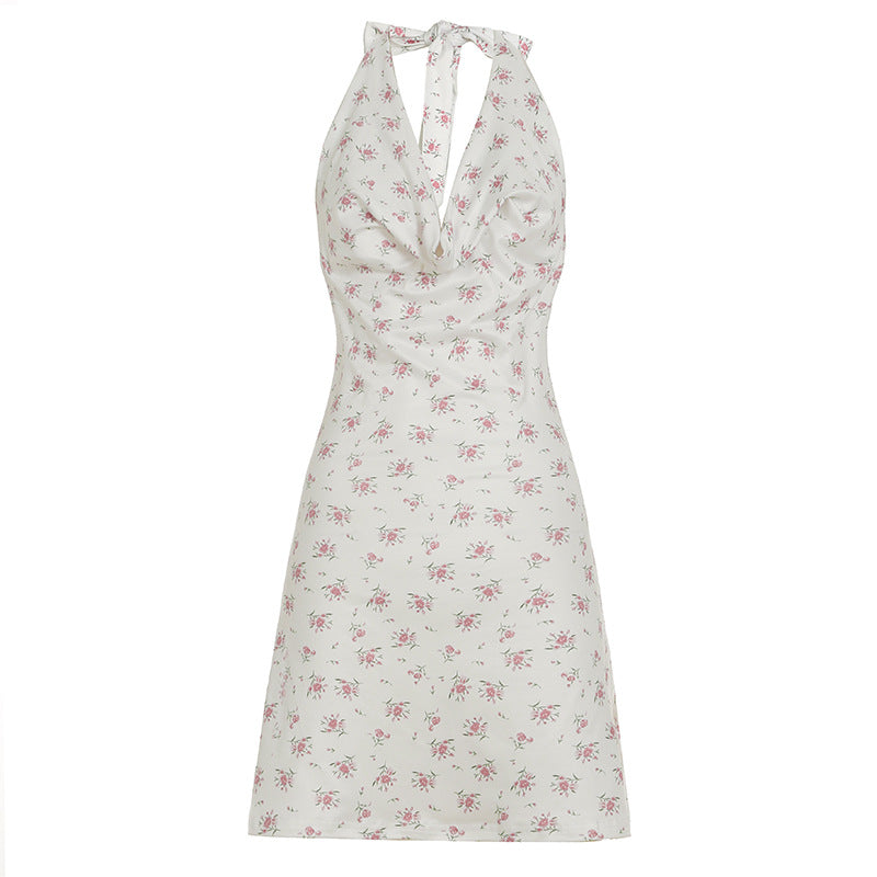 Damer luftigt sommardress med lekfullt blommönster och djupt V-utsnitt Mirla-Eva Jonsson