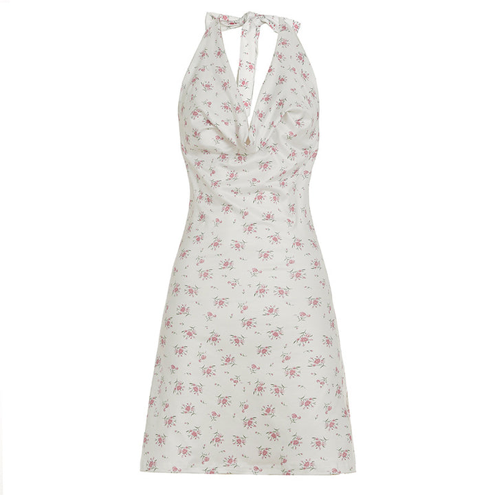 Damer luftigt sommardress med lekfullt blommönster och djupt V-utsnitt Mirla-Eva Jonsson