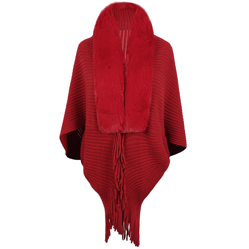 Damer lyxig stickad poncho med elegant konstpälskrage och fransar Mirla-Eva Jonsson