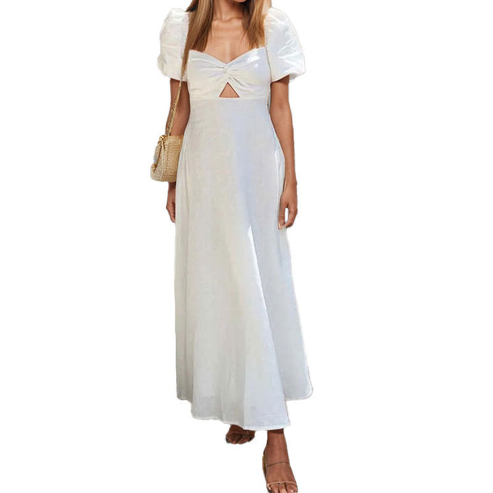 Damer maxi-klänning med sofistikerad nyckeldesign och voluminösa puffärmar Mirla-Eva Jonsson