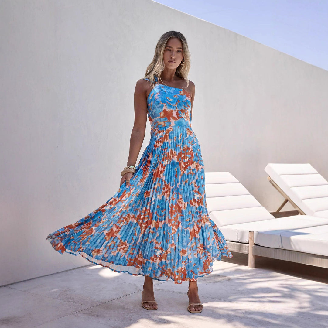 Damer maxi klänning med svängande plisserad kjol och feminin blommönster-Eva Jonsson