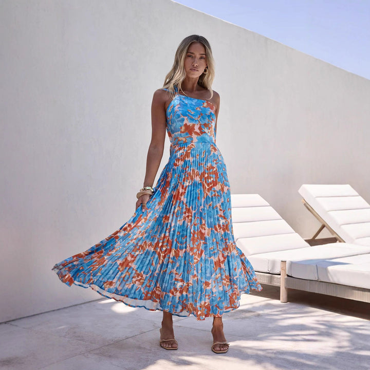 Damer maxi klänning med svängande plisserad kjol och feminin blommönster-Eva Jonsson