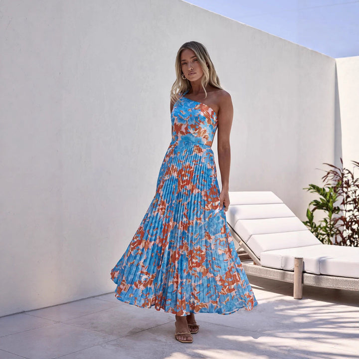 Damer maxi klänning med svängande plisserad kjol och feminin blommönster-Eva Jonsson