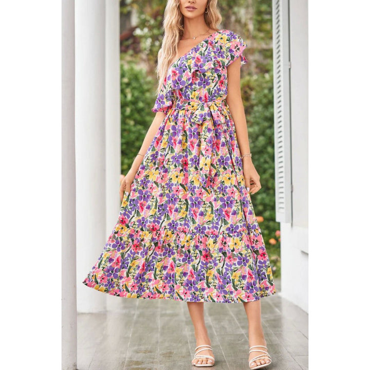 Damer maxiklänning med asymmetrisk skärning och blommigt volangdesign Mirla-Eva Jonsson