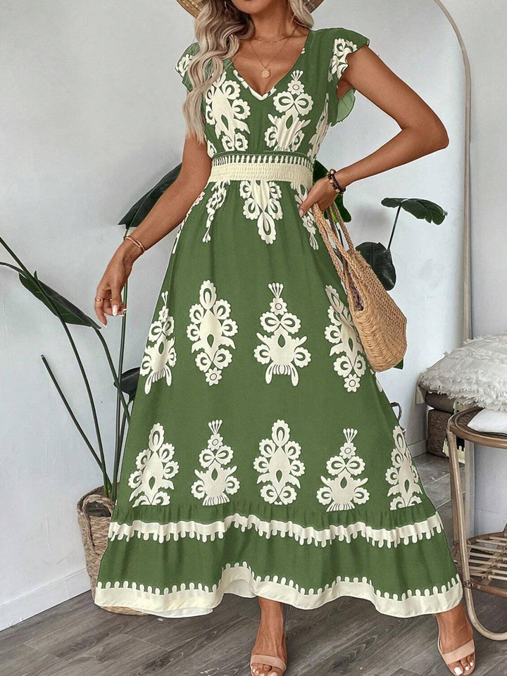 Damer maxiklänning med blommig print och smickrande V-ringning Mirla-Eva Jonsson