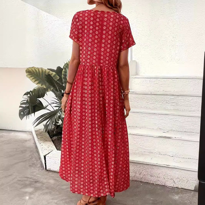 Damer maxiklänning med blommönster och generösa sidofickor Mirla-Eva Jonsson