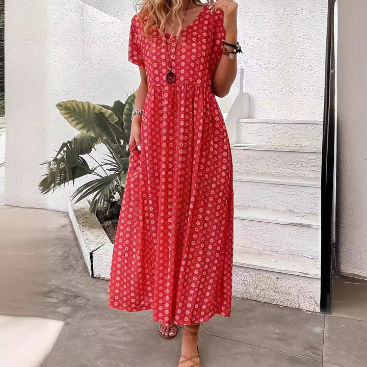 Damer maxiklänning med blommönster och generösa sidofickor Mirla-Eva Jonsson
