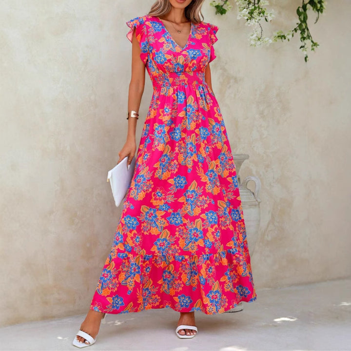 Damer maxiklänning med flödande tyg och blommiga mönster Eva Jonsson-Eva Jonsson