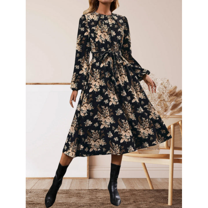 Damer midiklänning med blommönster och midjebälte Mirla-Eva Jonsson