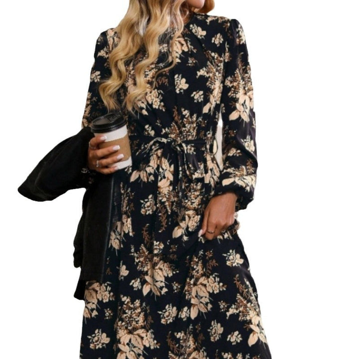 Damer midiklänning med blommönster och midjebälte Mirla-Eva Jonsson