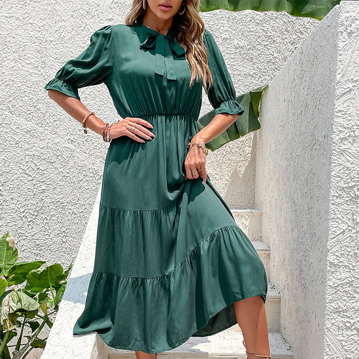 Damer midiklänning med elegant volangkant och stilig ståkrage Mirla-Eva Jonsson