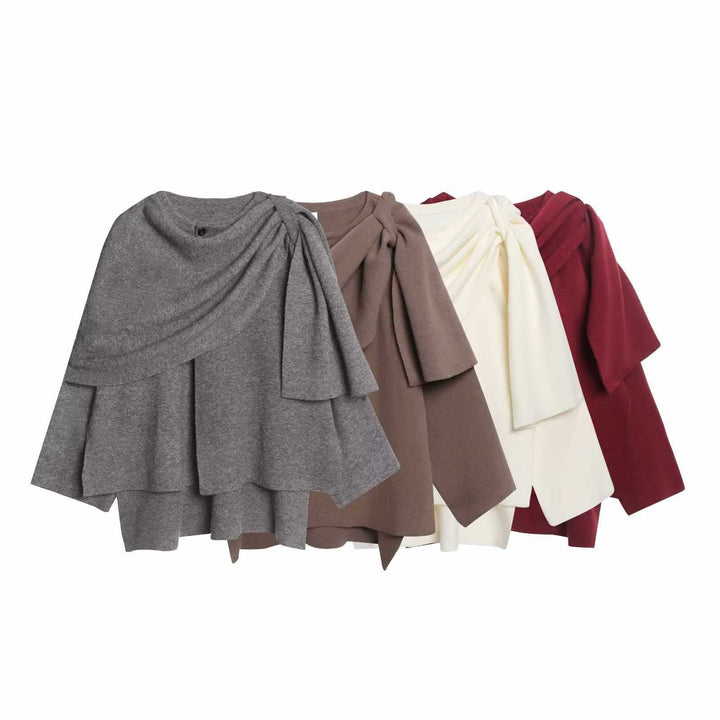 Damer moderiktig poncho med asymmetrisk skärning och elegant drapering Mirla-Eva Jonsson