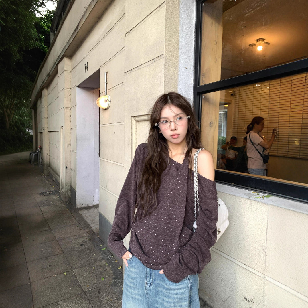 Damer modern topp med asymmetrisk halsringning och elegant rem Mirla-Eva Jonsson