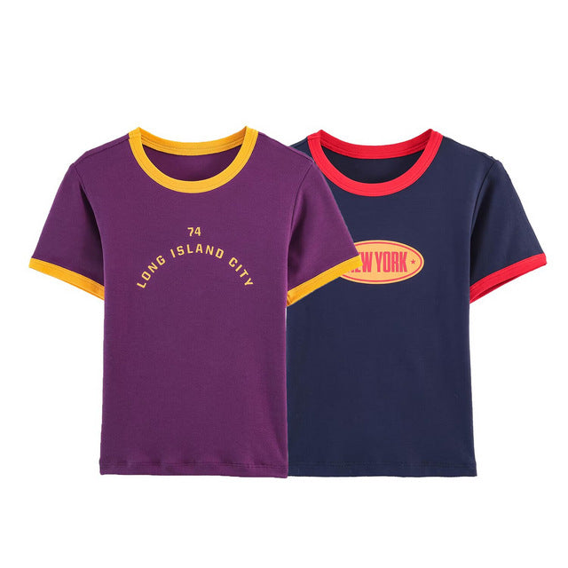 Damer modernt T-shirt med kontrasterande ärmar och tryckt text Mirla-Eva Jonsson